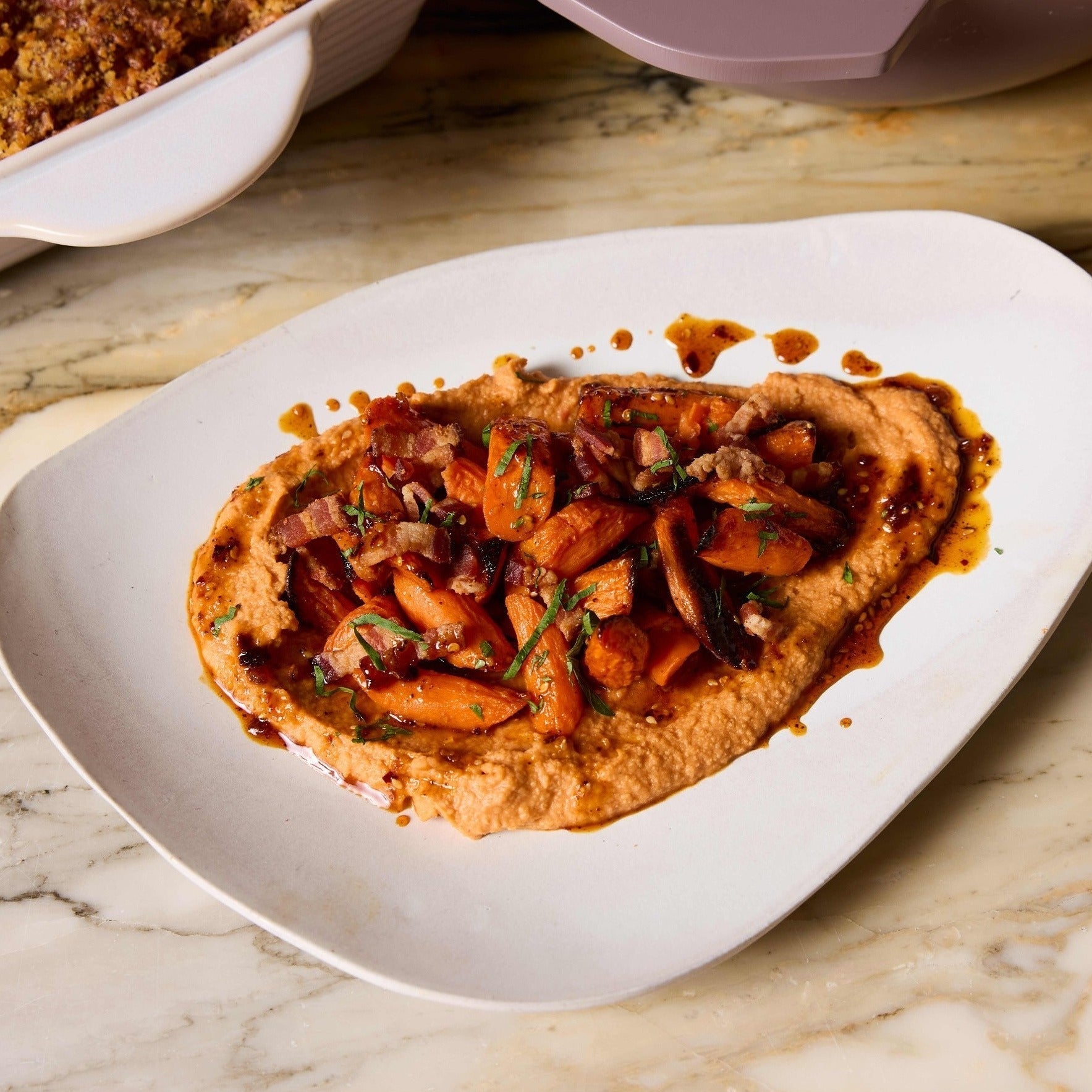 Maple-Roasted Carrots with Hummus Whipped with Cravings Creamy Tomato Sauce