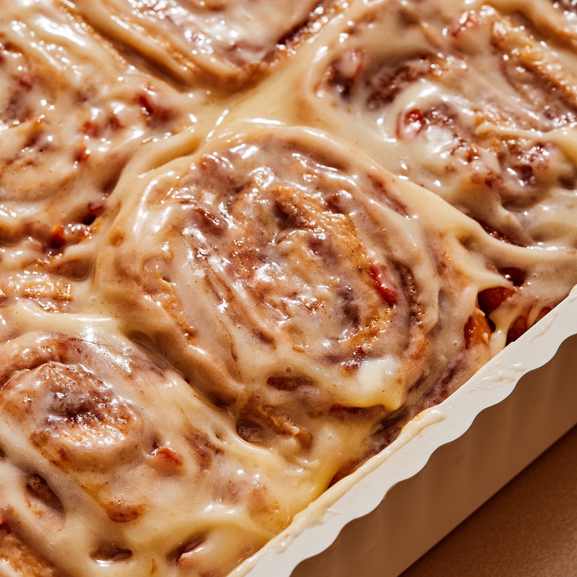 Sticky Carrot Cake Cinnamon Rolls with Maple Cream Cheese Glaze